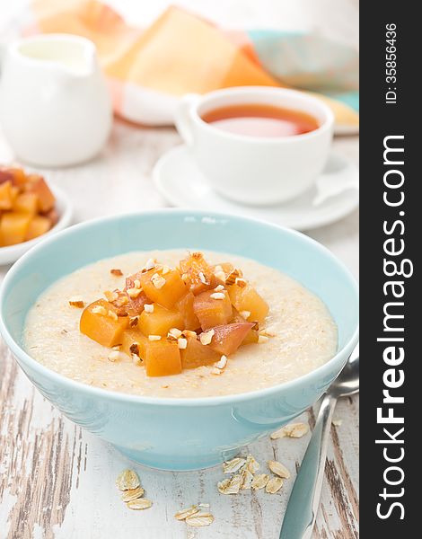 Oatmeal with caramelized peaches, close-up, vertical