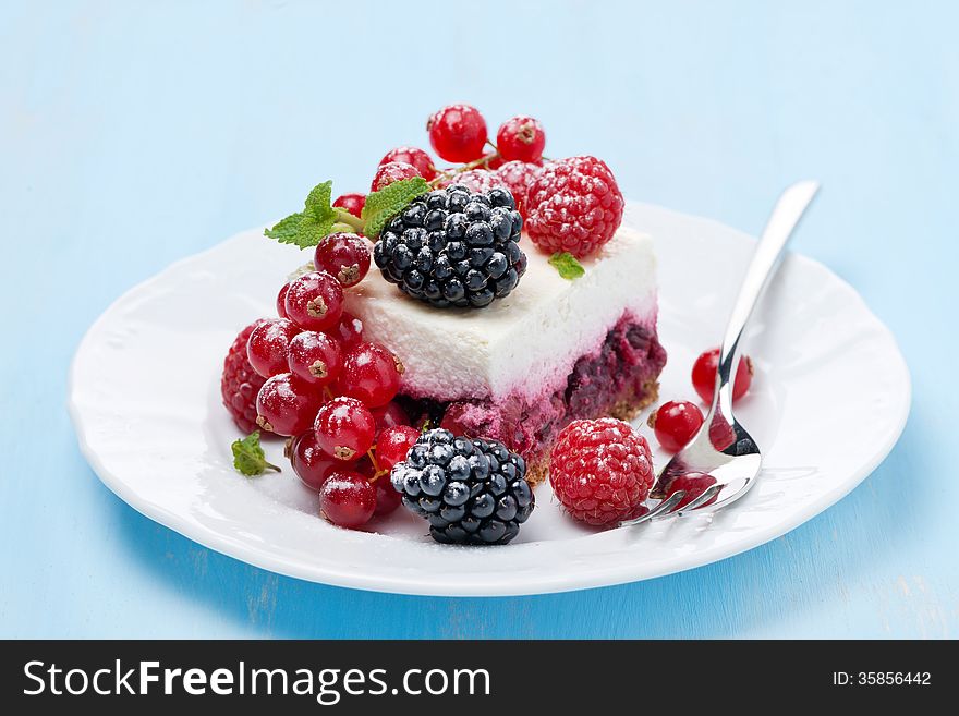 Piece Of Cheesecake With Fresh Berries On The Plate