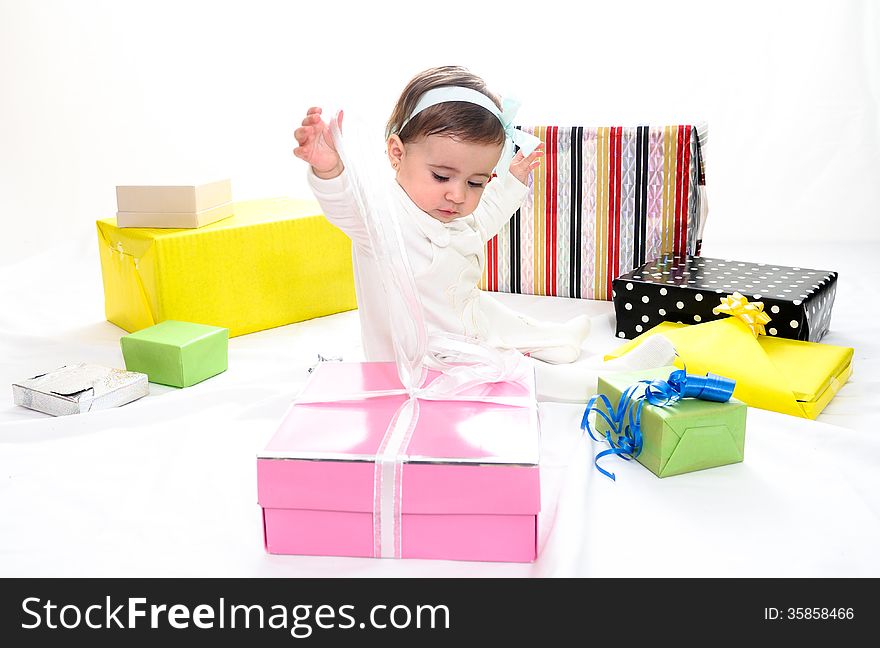 Portrait of a baby girl with gifts