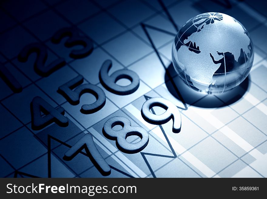 Business concept. Glass globe on background with diagram and numbers. Business concept. Glass globe on background with diagram and numbers