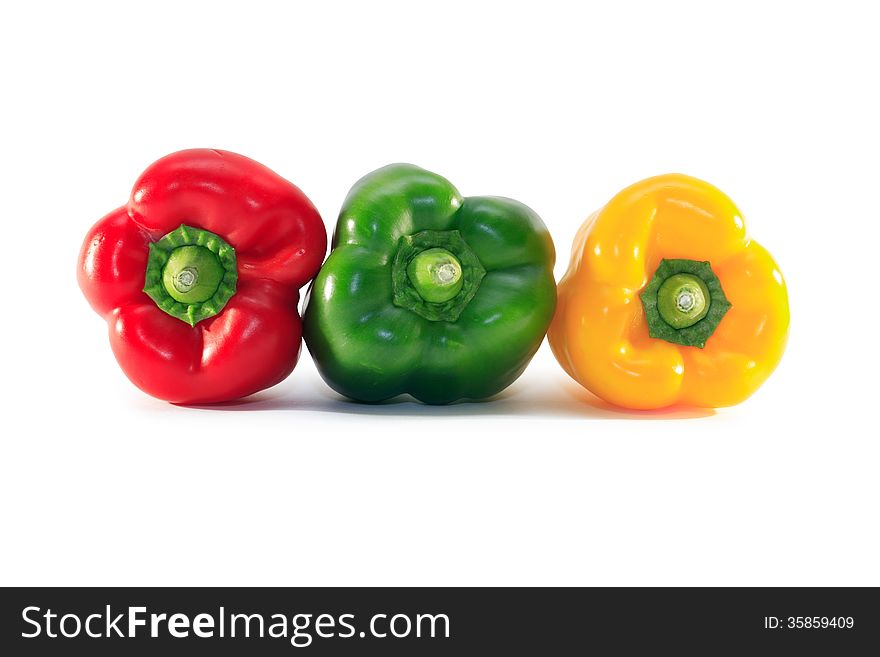 Three colored sweet pepper on white background. Clipping path is included