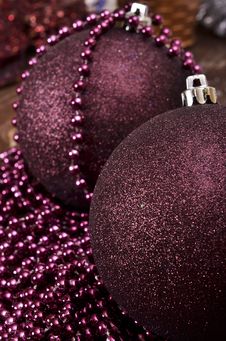 Large Christmas Balls And Beads On A Wooden Background Stock Images