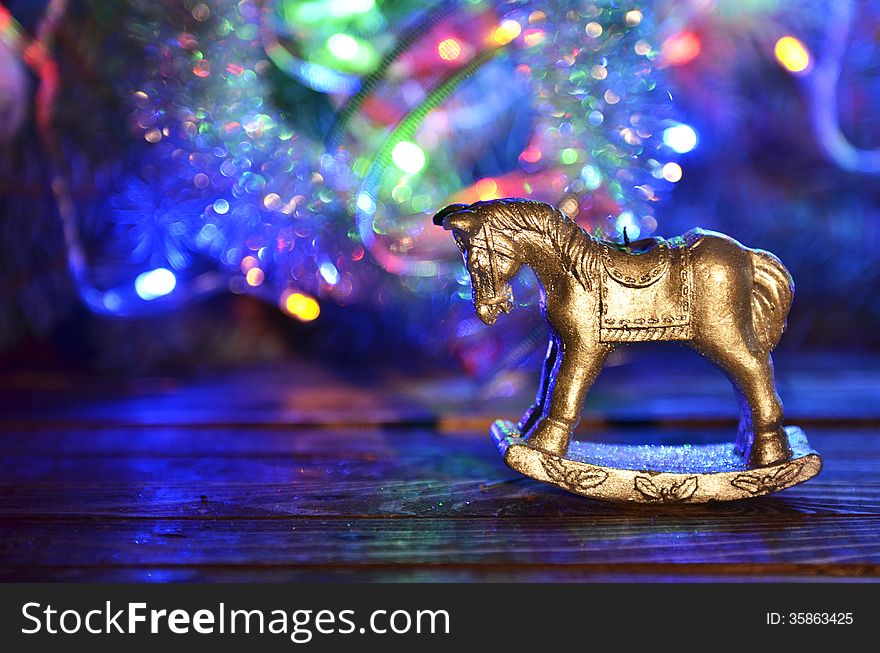 New Year`s candle in the form of a horse