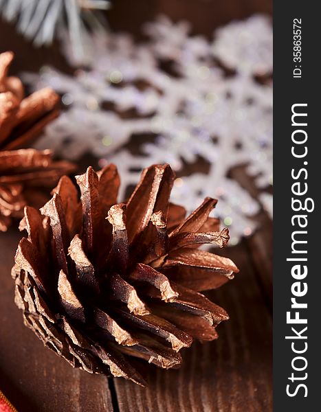 New Year`s composition of a pine cones and snowflakes