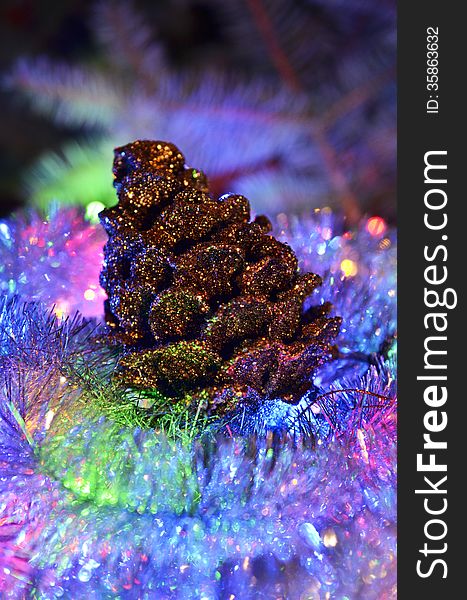 New Year`s composition of a pine cones and tinsel