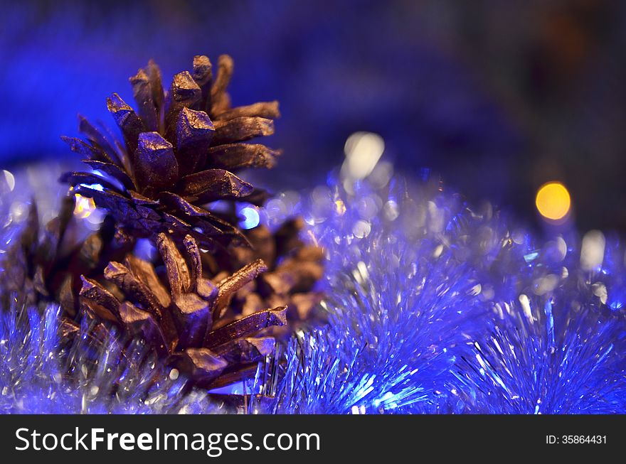 New Year`s composition of a pine cones and tinsel