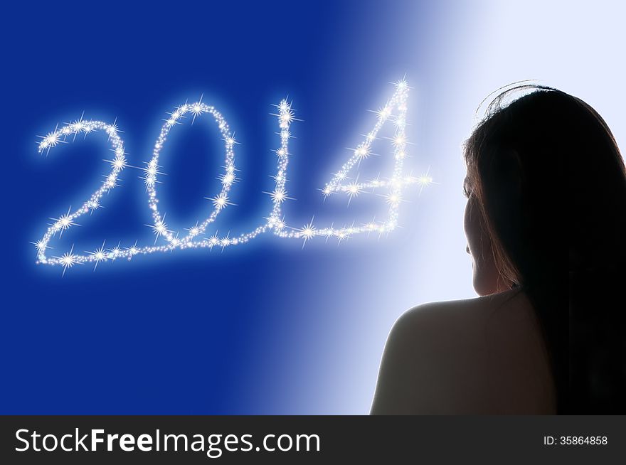 Picture of a girl watching 2014 sparklers. Picture of a girl watching 2014 sparklers