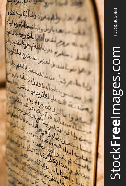 A Koran written on a board with shallow depth of field. A Koran written on a board with shallow depth of field