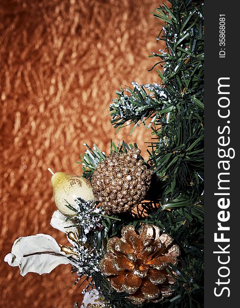 Christmas balls and fir tree on a gold background. Christmas balls and fir tree on a gold background