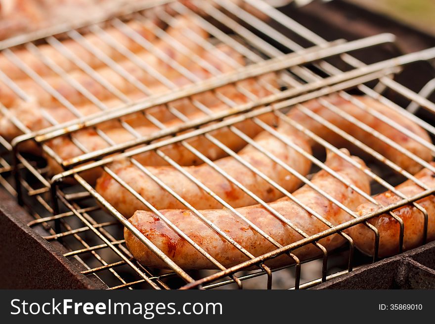 Delicious german sausages on the barbecue grill. Delicious german sausages on the barbecue grill