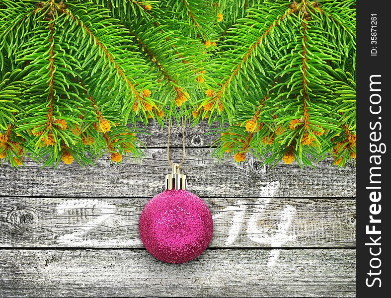 Branches Of  Christmas Tree On A  Wooden Background.