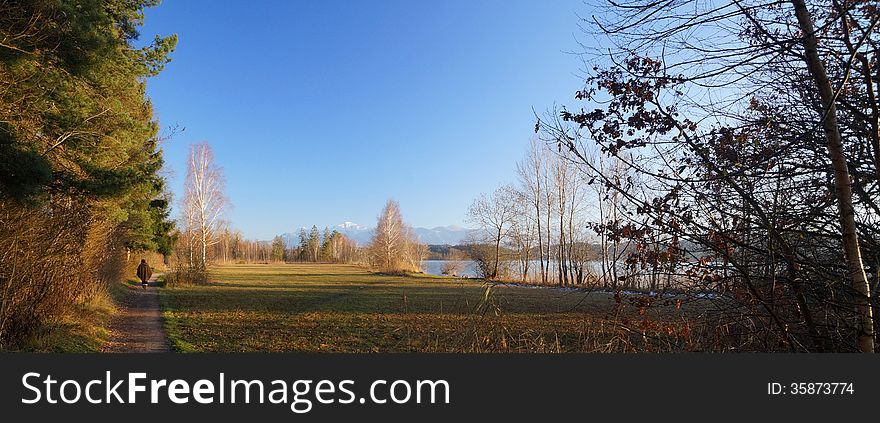 Lake Staffel (Staffelsee), one of the Bavarian lakes, on a late afternoon in December. The snow-capped Alps are in the distance.