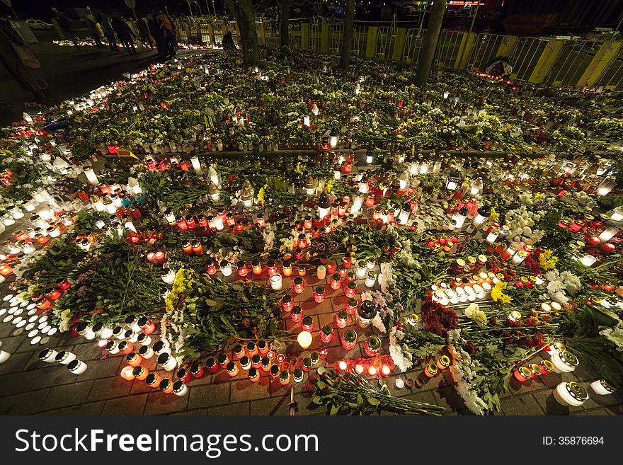 Huge amount of Flowers and Candles in front of place of a tragedy. Huge amount of Flowers and Candles in front of place of a tragedy