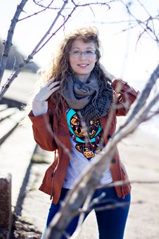 Happy Woman With Glasses And Curly Hair On Bright Sunny Background Royalty Free Stock Photography Happy Woman With Glasses And Curly Hair On Bright Sunny Background Royalty Free Stock Photography