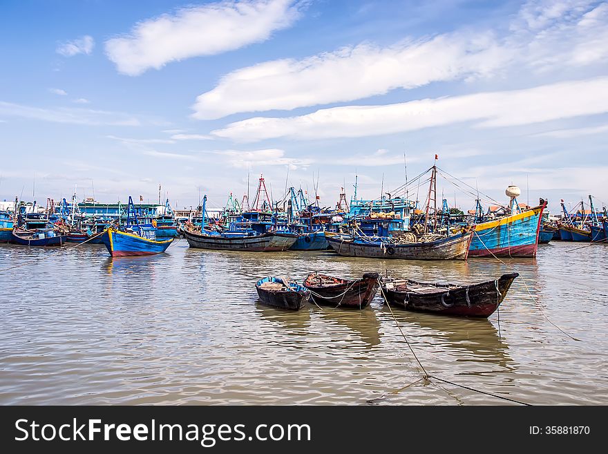 Fishing boats moored in fishing port.