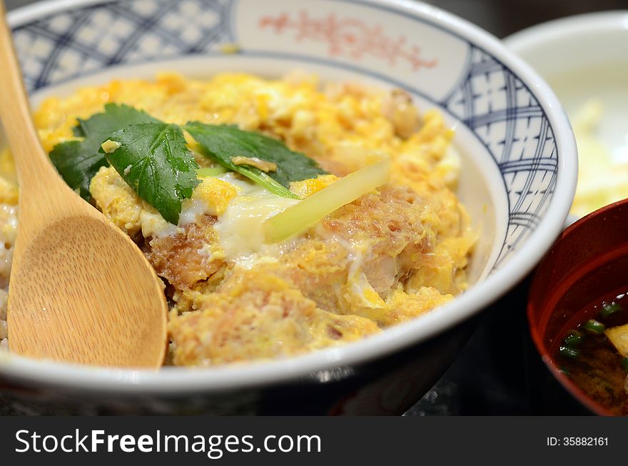 Japanese cuisine, Close up of Katsudon pork cutlet with fried egg on rice. Japanese cuisine, Close up of Katsudon pork cutlet with fried egg on rice