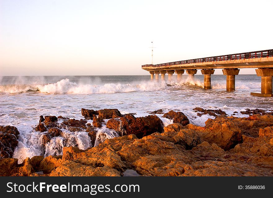 Waves crash under Shark Rock Pier on Port Elizabeth's beachfront in South Africa. Waves crash under Shark Rock Pier on Port Elizabeth's beachfront in South Africa.