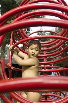 Kid Playing In Playground Stock Photography
