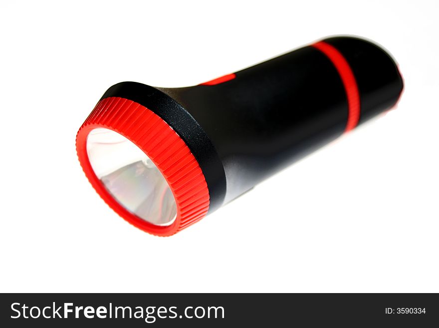 Black flashlight isolated on a white background. Black flashlight isolated on a white background