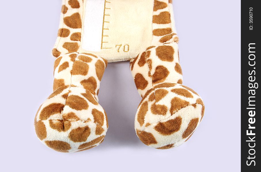 Close-up of the feet of a stuffed toy isolated. Close-up of the feet of a stuffed toy isolated.