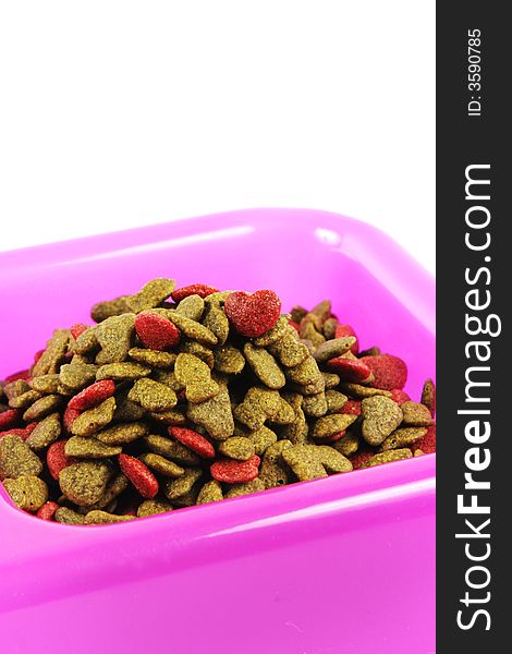 Bowl of pet food isolated on a white background.
