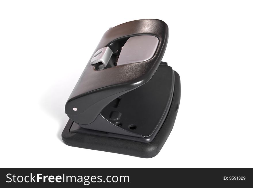 Black office hole puncher isolated on white background. Clipping path included. Black office hole puncher isolated on white background. Clipping path included.