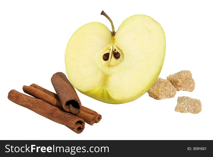 Half of a apple with cinnamon and sugar on white background