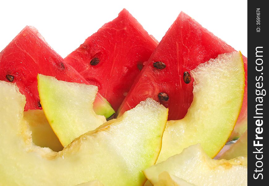 Slices of watermelon and muskmelon isolated on white