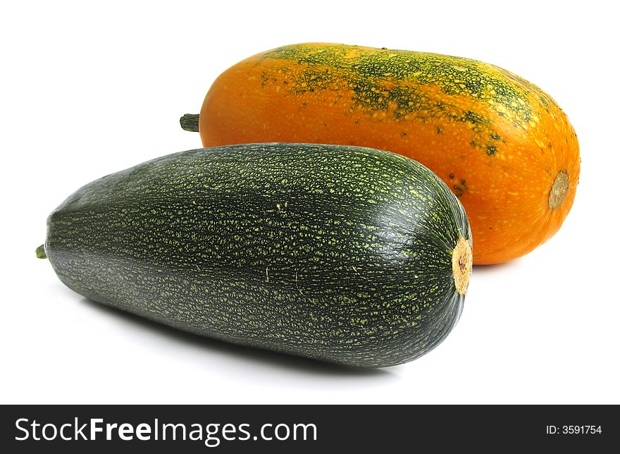 Yellow and green summer squashes on white background