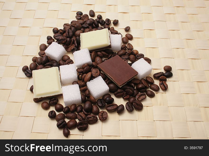 Coffee beans and sugar and chocolade. Coffee beans and sugar and chocolade