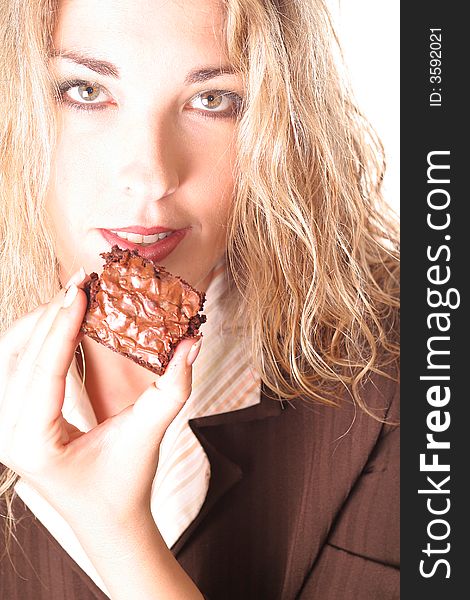 Gorgeous woman eating brownie