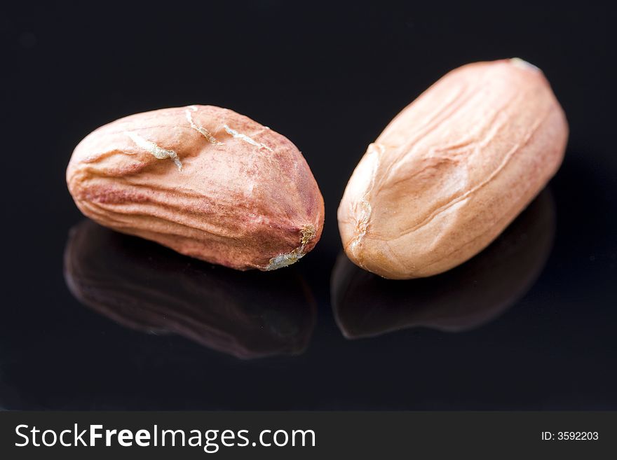 Two nuts that have been removed from their shell. Two nuts that have been removed from their shell