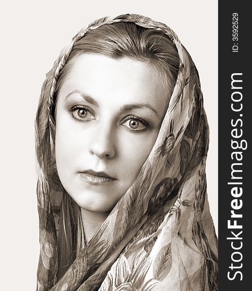 Portret of sad girl with shawl on head. In sepia. Portret of sad girl with shawl on head. In sepia.