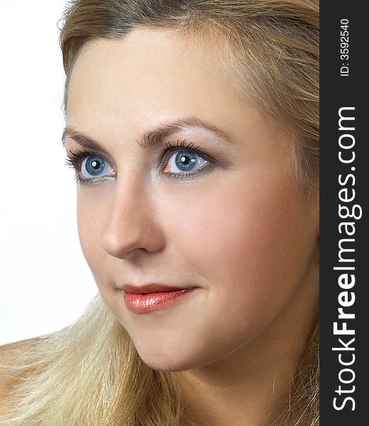 Portret of young blond girl on white background