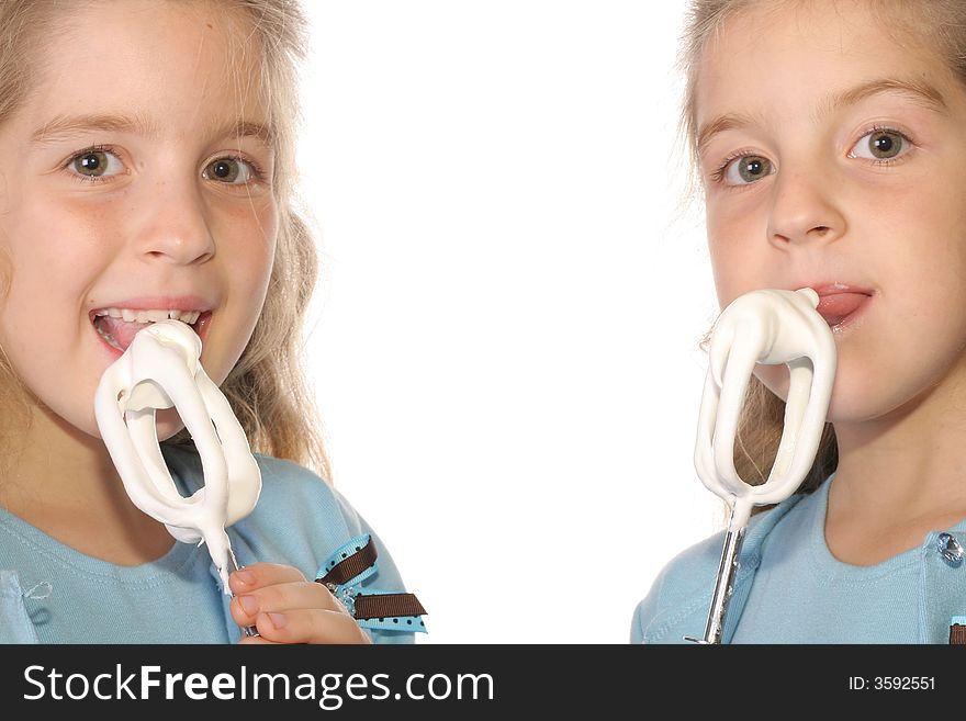 Shot of happy children licking frosting