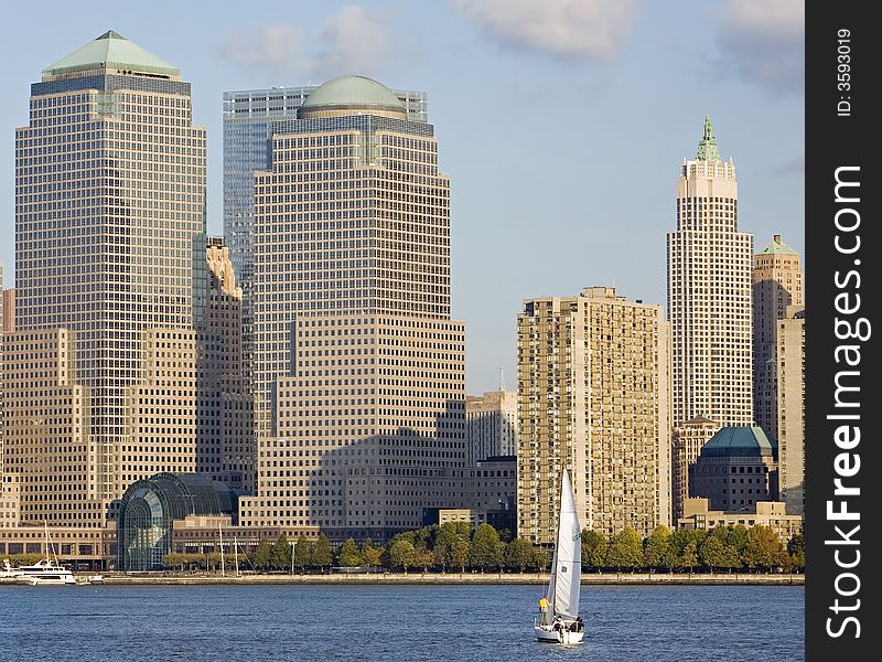 Sailboat on the Hudson River with the buildings of Lower Manhattan in the background. Sailboat on the Hudson River with the buildings of Lower Manhattan in the background.