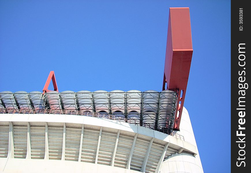 A part of the S. Siro stadium in Milan under a blue sky