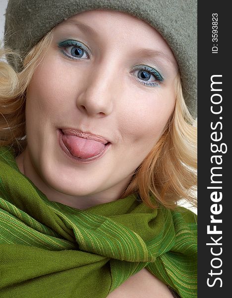 Expressing positivity cute blond girl with green scarf portrait (series). Expressing positivity cute blond girl with green scarf portrait (series).