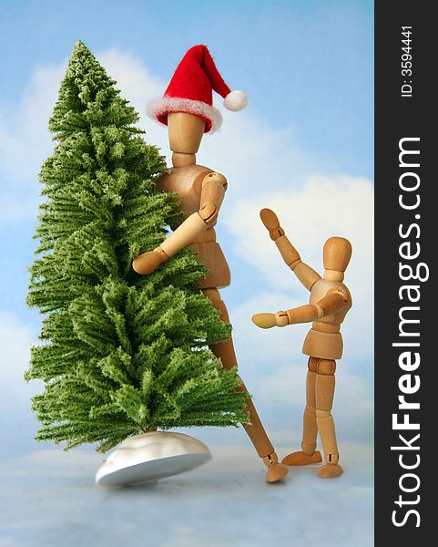 Adult and child figurines finding the perfect christmas tree. Adult and child figurines finding the perfect christmas tree.