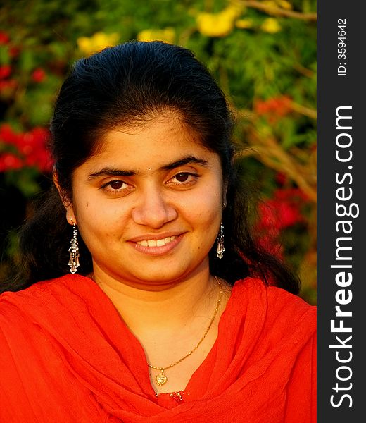 A portrait of a simple indian girl with bright face. A portrait of a simple indian girl with bright face.