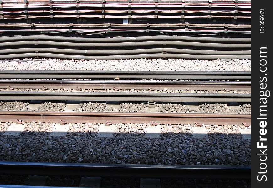 Close shot of a rail, composing symmetric horizontal lines. Close shot of a rail, composing symmetric horizontal lines