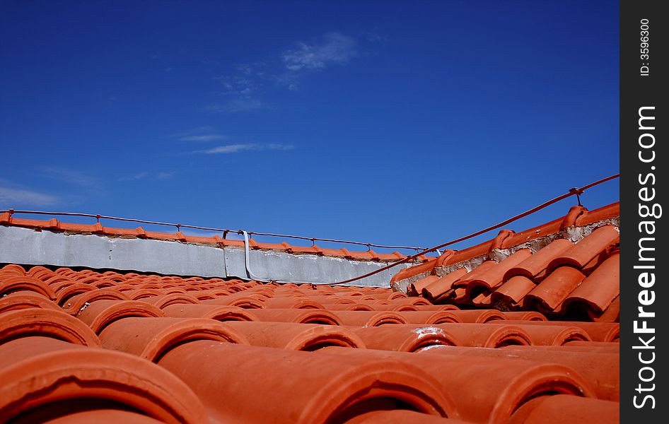 Red bricks on rooftop and clear blue sky. Red bricks on rooftop and clear blue sky.