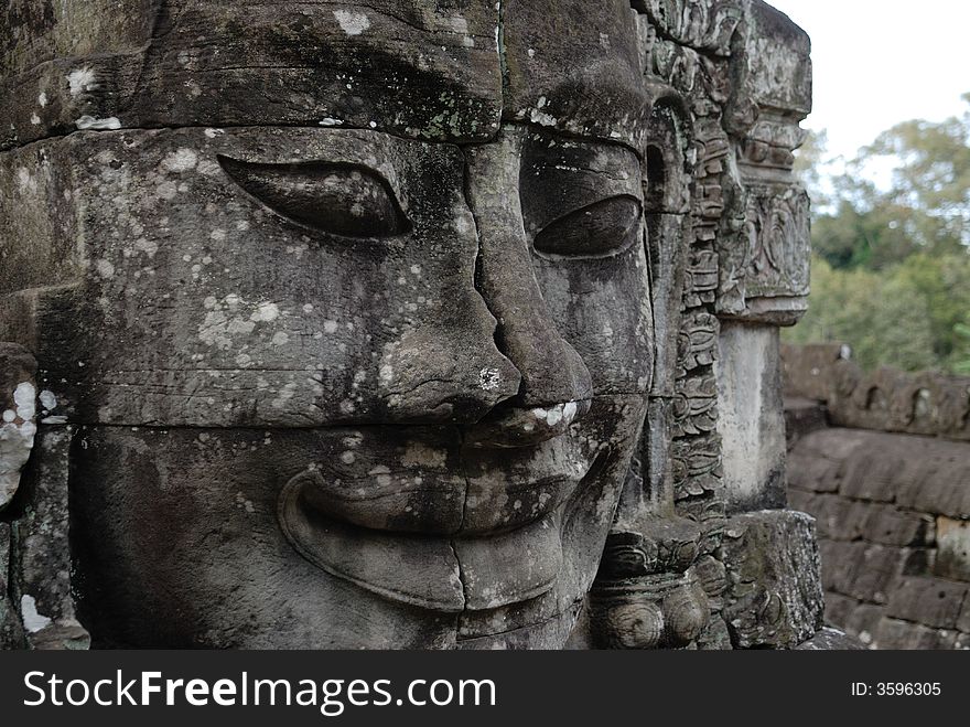 The stone Buddha face at Angkor Wat, Bayon, Cambodia. The stone Buddha face at Angkor Wat, Bayon, Cambodia.
