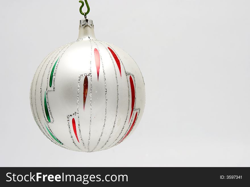 Christmas decoration - glass ball isolated on light background