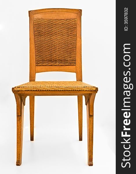 A classic wooden-wicker chair on white front view. A classic wooden-wicker chair on white front view