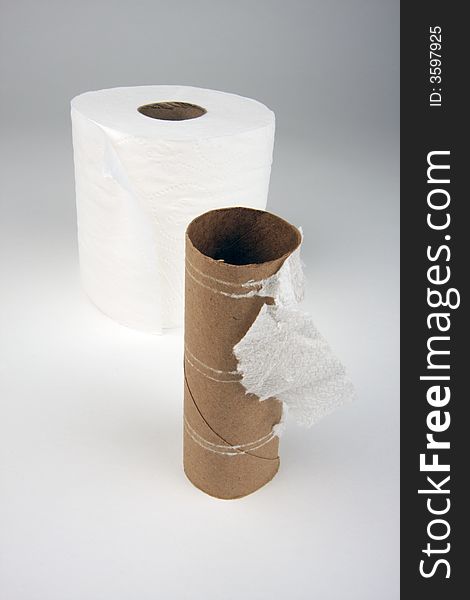 Abstract Conceptual Empty and Full Toilette Paper Rolls.