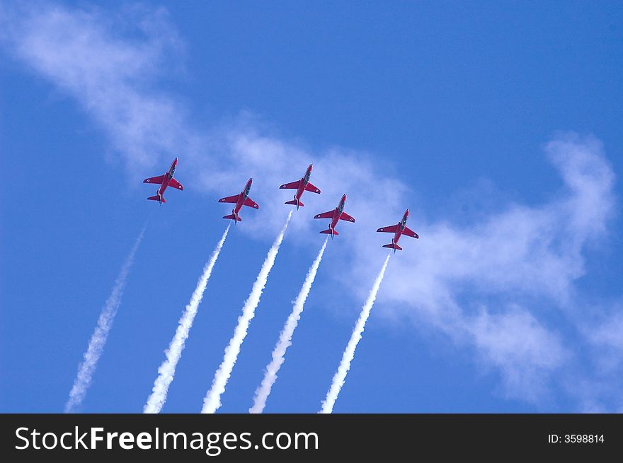 Five member of the red arrow taking a maneuver for their aerobatic show. Five member of the red arrow taking a maneuver for their aerobatic show