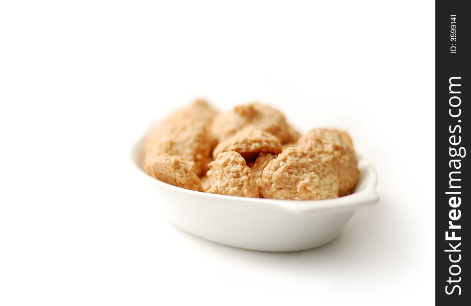 Plate of sesame cookies isolated on white (low depth of field). Plate of sesame cookies isolated on white (low depth of field)