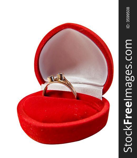 The golden ring in red box in shape of heart, maybe engagement. Isolated on a white background, working path included.