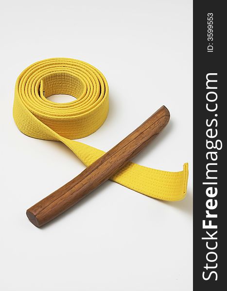 Yellow karate belt, martial arts grade plus a wooden tanto knife. Yellow karate belt, martial arts grade plus a wooden tanto knife